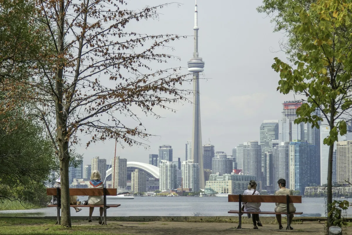 Toronto skyline at sunset with the CN Tower and Lake Ontario